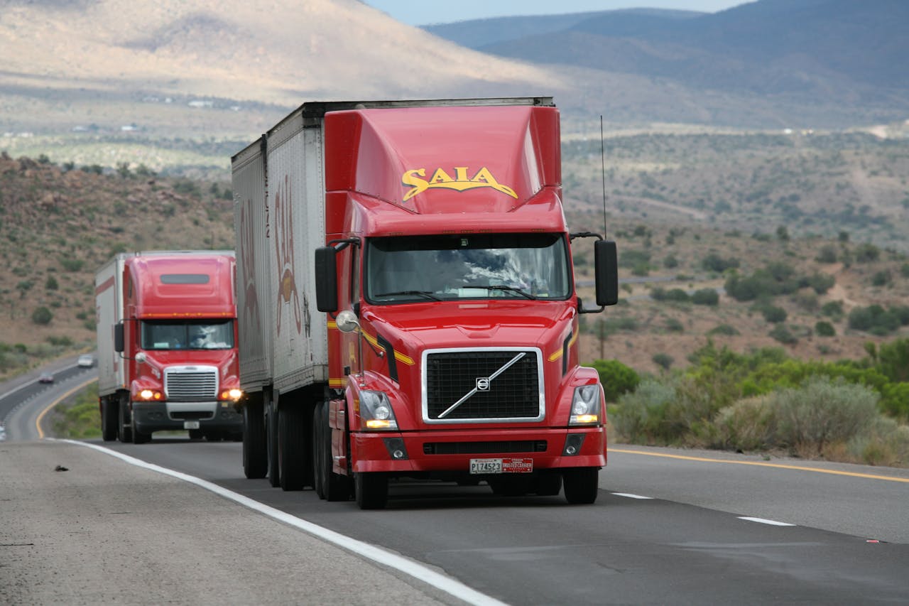 Freight truck delivering cargo on a highway at dusk